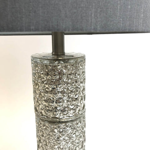 The lamp fixture is made of mercury crystal. It is strong yet lightweight lamp. The circle pattern on the crystal creates elegant look of the lamp.